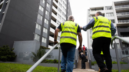 Building engineers inspect the Vicinity apartment complex last Wednesday,