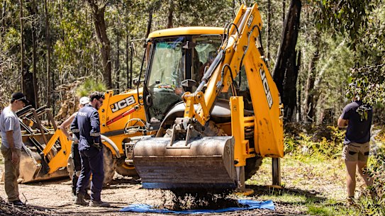 Earthmoving equipment arrives to help in the search for Russell Hill and Carol Clay.