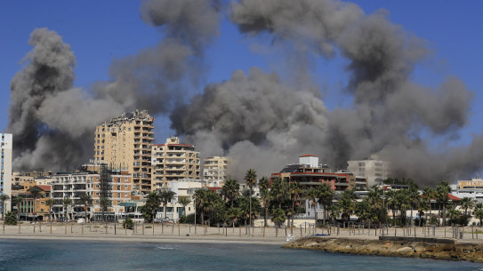 Smoke rises from buildings hit in Israeli airstrikes in Tyre, Lebanon.