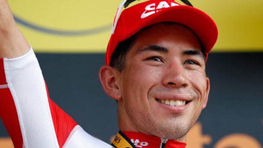 Australia's Caleb Ewan celebrates on the podium after he won the Tour de France's 16th stage. 