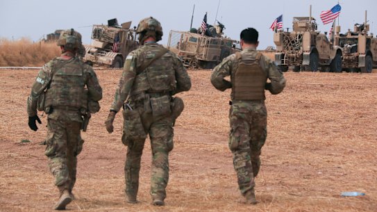 An American military convoy stops near the town of Tel Tamr, north Syria, on Sunday.