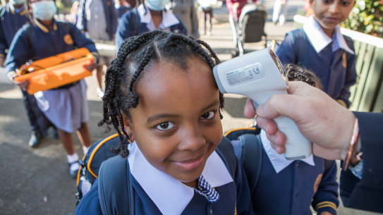 Students at St Brendan's Primary School in Flemington return to school.