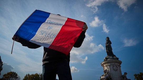 France has launched raids hunting for Islamic extremists as Parisians hold vigils for beheaded teacher Samuel Paty.