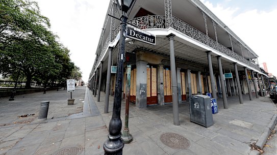 Fearing the worst: boarded up businesses are seen along Jackson Square, normally bustling with tourists, in the nearly deserted French Quarter of New Orleans.