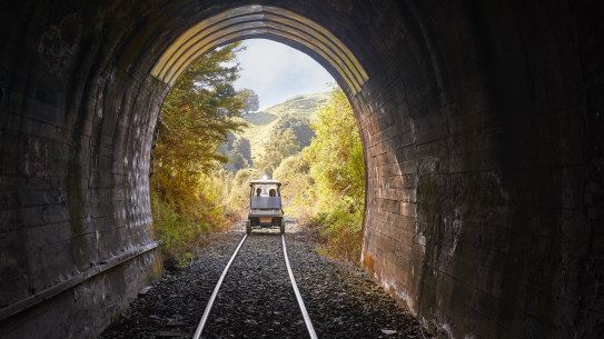 Through an old railway tunnel in a converted golf buggy with Forgotten World Adventures.