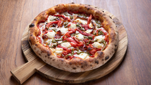 The Faz pizza topped with roasted peppers, pancetta, pesto, mozzarella and feta.