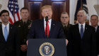 US President Donald Trump was flanked by his vice president, cabinet secretaries and senior military officers in their uniforms. 