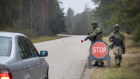 Lithuanian soldiers patrol a road near the Lithuania-Belarus border some 160 km south of the capital Vilnius.