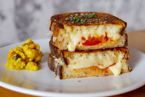 Three-cheese toastie with warrigal greens, kimchi and tomato.