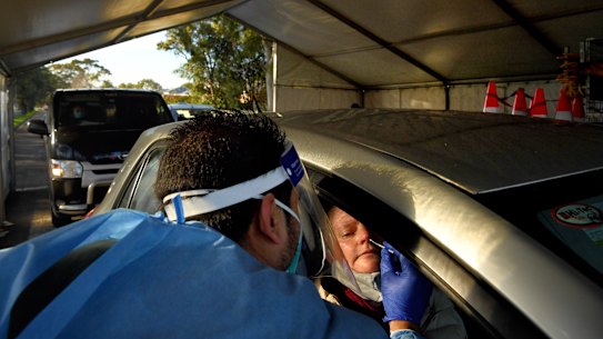 Laverty Pathology staff conducting COVID-19 tests at the Roselands drive through testing clinic, Sydney.