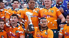 Brandon Paenga-Amosa of the Wallabies holds up the trophy.