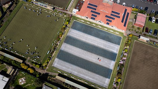 The Cats-mad groundskeeper Jamie Wray at Belmont Bowls Club has painted one of the bowling greens in the Geelong colours ahead of the Grand Final against the Sydney Swans on Saturday. 