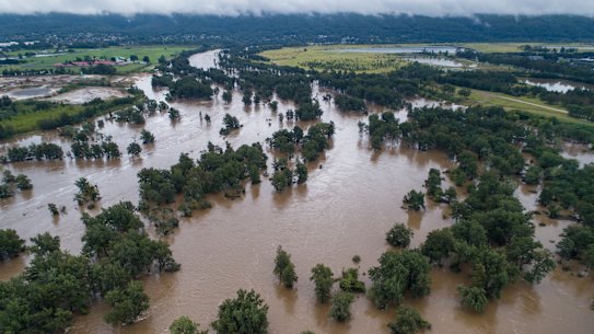 The swollen Nepean River near North Penrith on Tuesday. Concerns about what quality have prompted authorities to ramp up production from Sydney’s desalination plant.