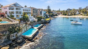 Billionaire software founder Christian Beck has paid a total of $36.5m for the two homes, each with harbourside pool.