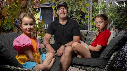 Lukas Winward, with daughters Maggie, left, and Layla.