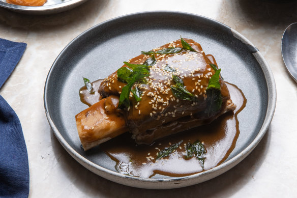 Beautifully tender slow-cooked beef short ribs are served with a ginger and coffee sauce.