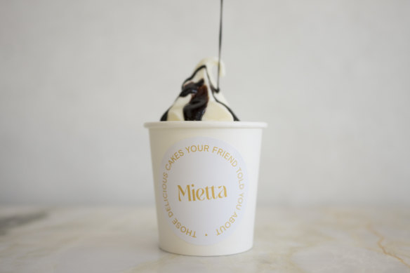 Vanilla soft-serve comes drizzled with Valrhona chocolate sundae sauce.