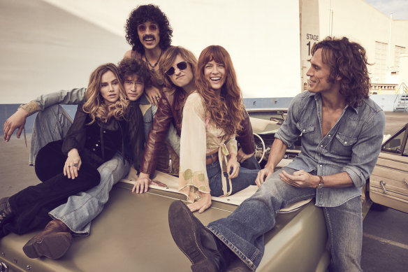 Daisy Jones & the Six are (from left) Suki Waterhouse, Will Harrison, Sebastian Chacon, Josh Whitehouse, Riley Keough and Sam Claflin.