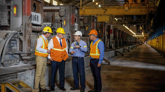 Prime Minister Scott Morrison and Trade Minister Dan Tehan at the Portland smelter with plant manager Ron Jorgensen and Alcoa Australia president Michael Gollschewski on Friday.