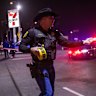 A police officer closes off the car park near the scene of the shooting in Stockton, California.