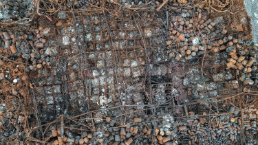 Drone shot shows the burnt remains of the factory.