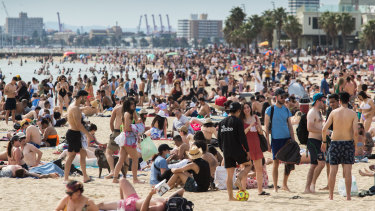 Thousands of people on St Kilda Beach.