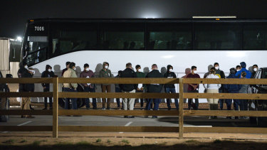 Migrant children and teenagers from the southern border of the United State are processed after entering the site of a temporary holding facility south of Midland, Texas. 