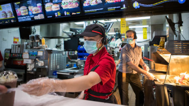 Staff at McDonald's in Boronia wearing masks on Tuesday.