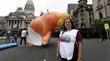 G20 protester Luciana Ghiotto in front of the blimp.