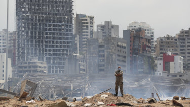 A soldier stands at the devastated site of the explosion in the Port of Beirut, Lebanon.