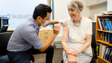 Dr Chris Lee vaccinates a Phase 1b patient at Lindfield Medical Practice on Monday.
