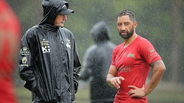 Benji Marshall and Wayne Bennett stop for one of their many chats at a soggy Redfrern this week.