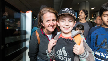 Sonya Gates and son Ryan, who queued for several hours to ride the metro trains on Sunday. 