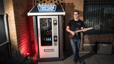 Jereme Clingan with the 24 Hour Toneshop 2.0 vending machine.