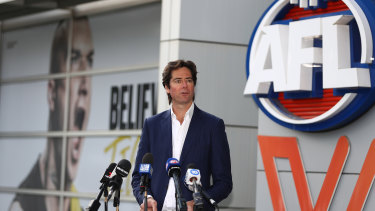 Gillon McLachlan outside AFL house where the menâ€™s and womenâ€™s league logos are situated.