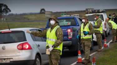 Soldiers assist police at a checkpoint near Geelong. 