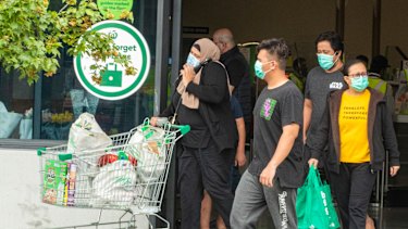 Masked shoppers at Berala in Sydney’s west on the weekend.