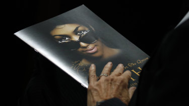 A attendee holds a program during the funeral service for Aretha Franklin.