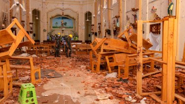 Sri Lankan soldiers inspect the damage inside St. Sebastian's Church where a bomb blast took place in Negombo, Sri Lanka.