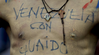 '"Venezuela with Guaido": Written on the body.