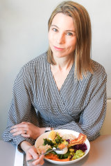 Dr Kate Gregorevic tucks into brekkie at Two Bob cafe in Melbourne's Clifton Hill. 