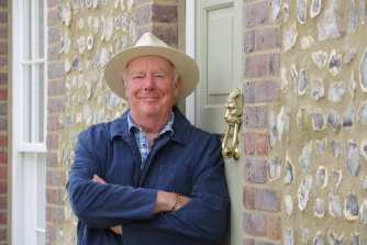 Poundbury Residents Association chair Blake Holt outside his flint-clad home. 