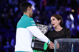 Tennis Australia chair Jayne Hrdlicka awards Novak Djokovic his ninth Australian Open trophy in 2021.