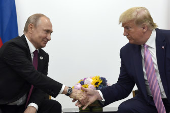 Putin praised former US president Donald Trump. The pair are pictured at a meeting in 2019.
