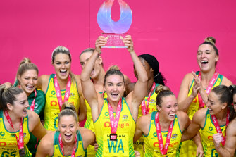 Australian captain Liz Watson lifts the trophy.