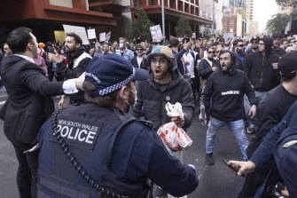 Anti-lockdown protesters clash with police in Sydney.