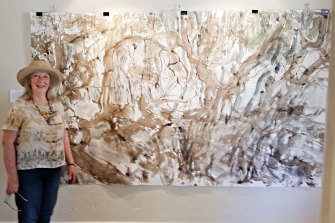 Walwa artist Barbara Pritchard with artwork from an earlier exhibition, Great River Road Obsession.