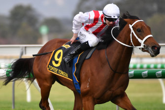 Damien Thornton rides Toffee Tongue to victory in the Australasian Oaks.