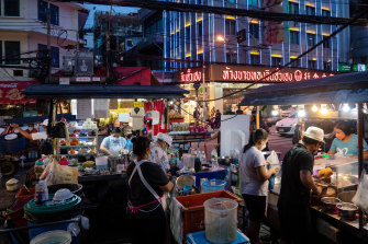 Street food vendors on Yaowarat Road in the Chinatown area of Bangkok.