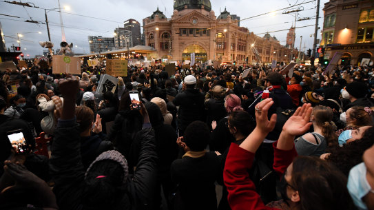 Protesters outside Flinders Station during a Black Lives Matter rally on Saturday. 